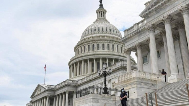 Police officers wearing face masks guard the US Capitol Building in Washington, US, May 14, 2020